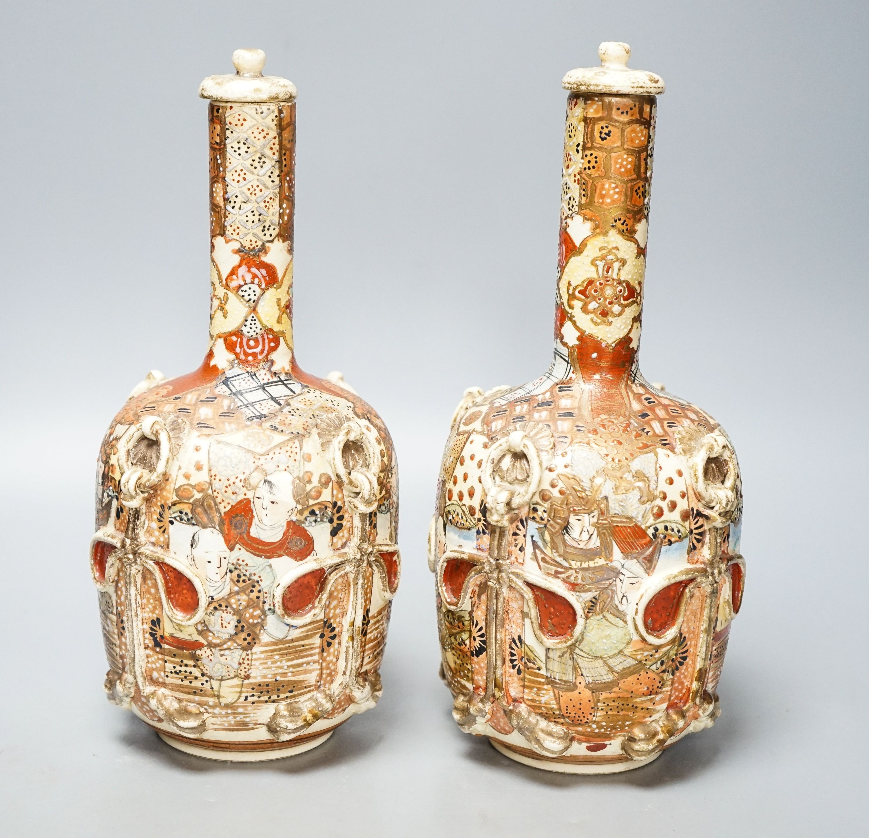 A pair of Japanese Satsuma pottery lidded bottle vases 27cm